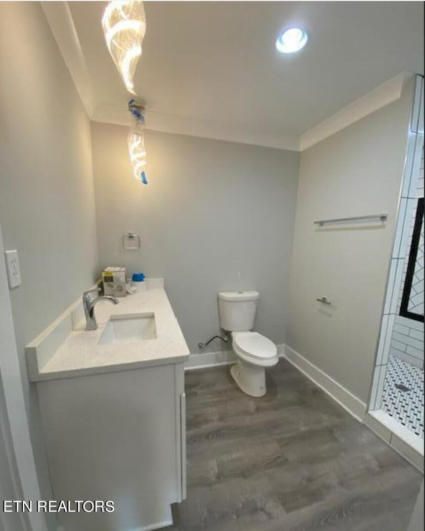 7120 Bonair Road Knoxville, TN 37918 - Photo 11 of 29 a bathroom with a sink toilet and vanity
