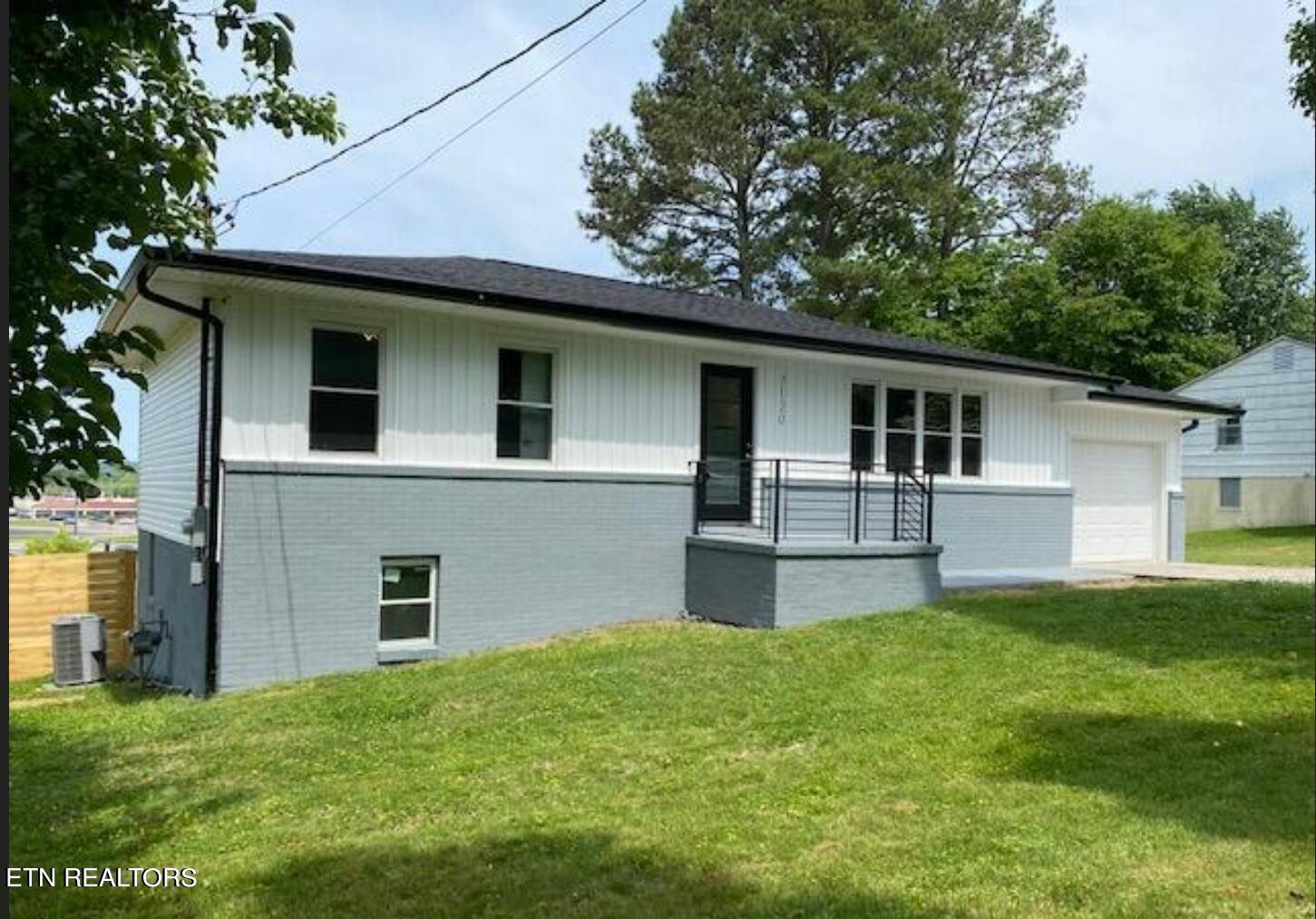 7120 Bonair Road Knoxville, TN 37918 - Photo 2 of 29 a front view of house with yard and trees in the background