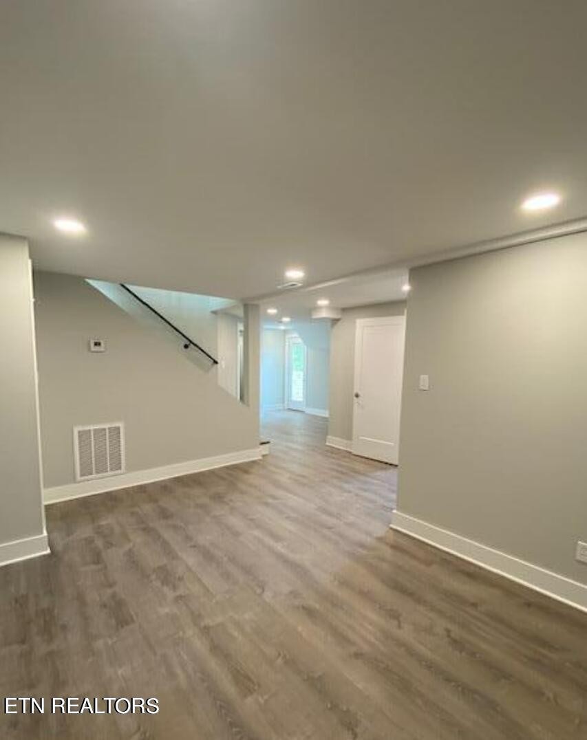 7120 Bonair Road Knoxville, TN 37918 - Photo 21 of 29 an empty room with wooden floor and windows