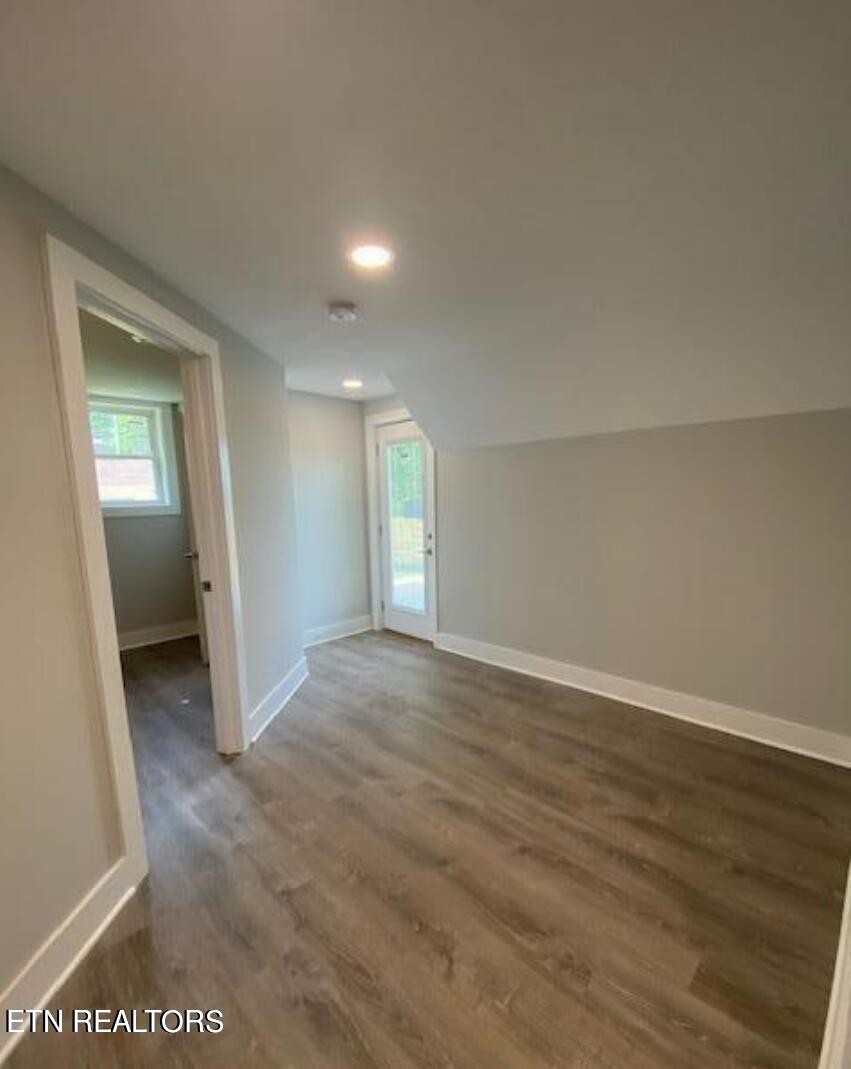 7120 Bonair Road Knoxville, TN 37918 - Photo 22 of 29 an empty room with wooden floor and mirror
