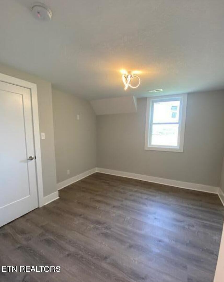 7120 Bonair Road Knoxville, TN 37918 - Photo 26 of 29 an empty room with wooden floor and windows