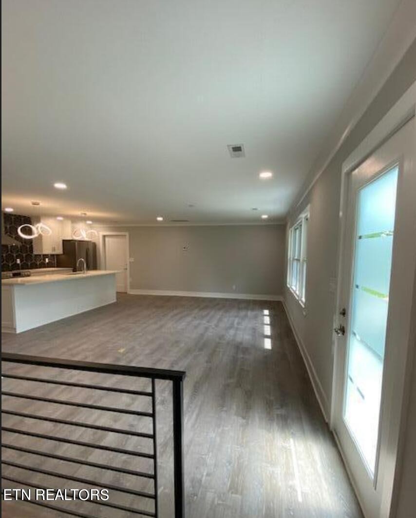 7120 Bonair Road Knoxville, TN 37918 - Photo 4 of 29 a view of kitchen and hall with wooden floor
