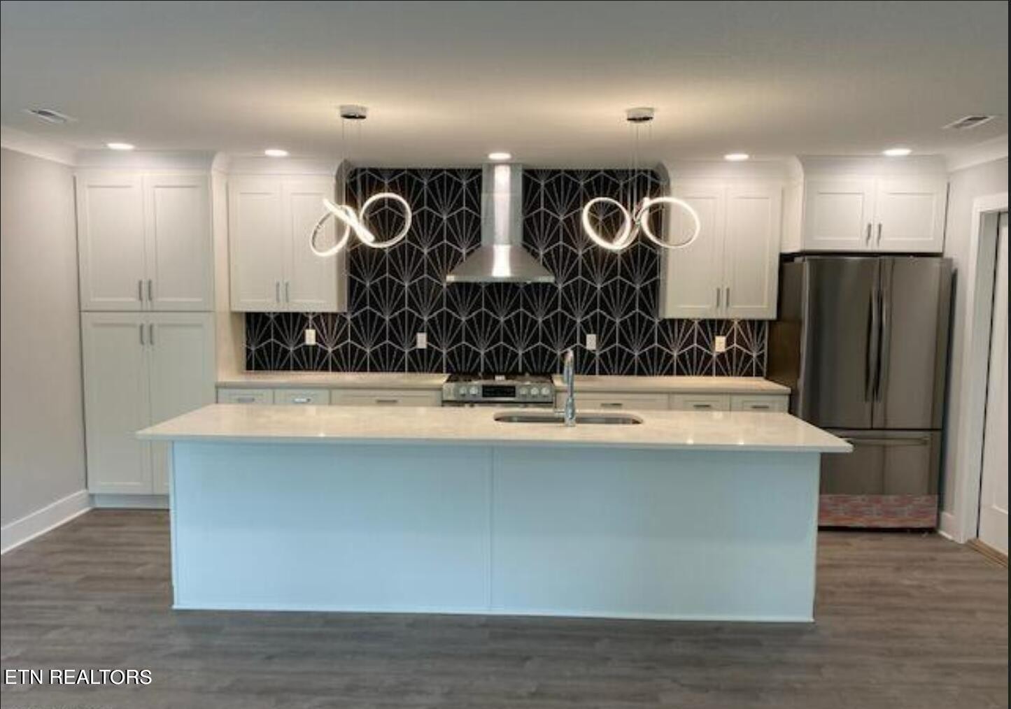 7120 Bonair Road Knoxville, TN 37918 - Photo 7 of 29 a large kitchen with stainless steel appliances kitchen island a large island in the center