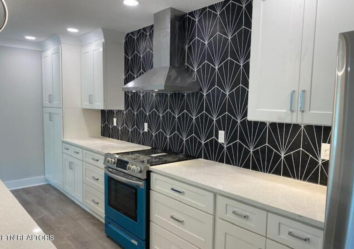 7120 Bonair Road Knoxville, TN 37918 - Photo 8 of 29 a kitchen with a sink stove and cabinets