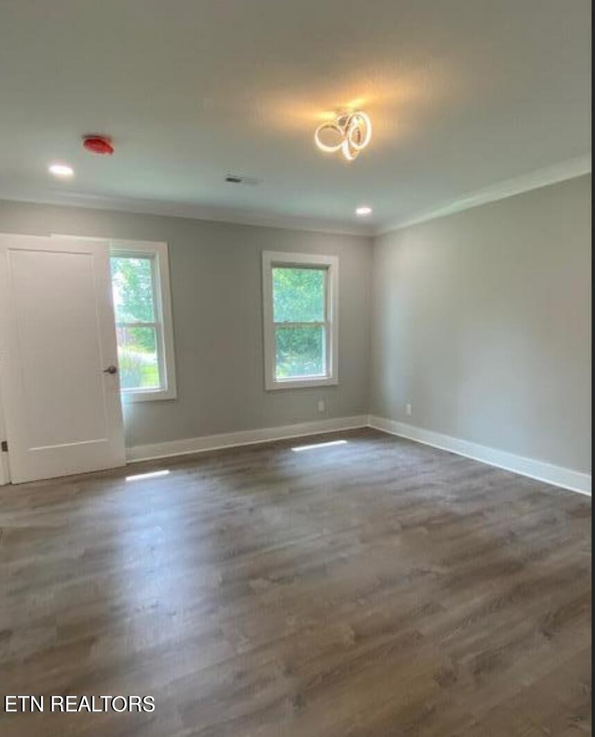 7120 Bonair Road Knoxville, TN 37918 - Photo 10 of 29 an empty room with wooden floor and windows