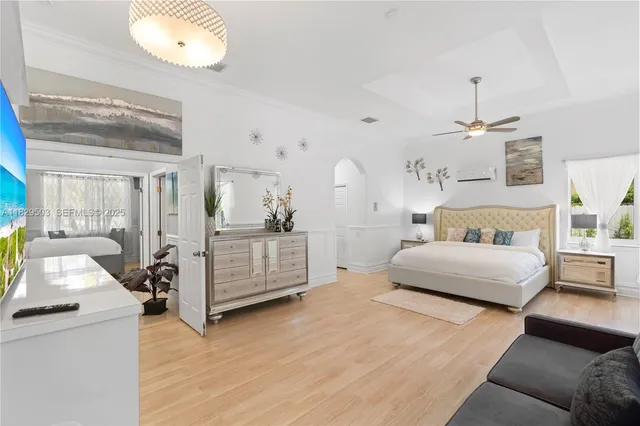 a bedroom with a bed and a couch