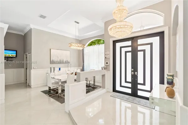 a very nice looking room with a large window and dining table