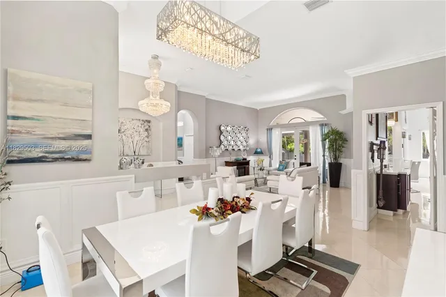 a living room with furniture fireplace and a large window