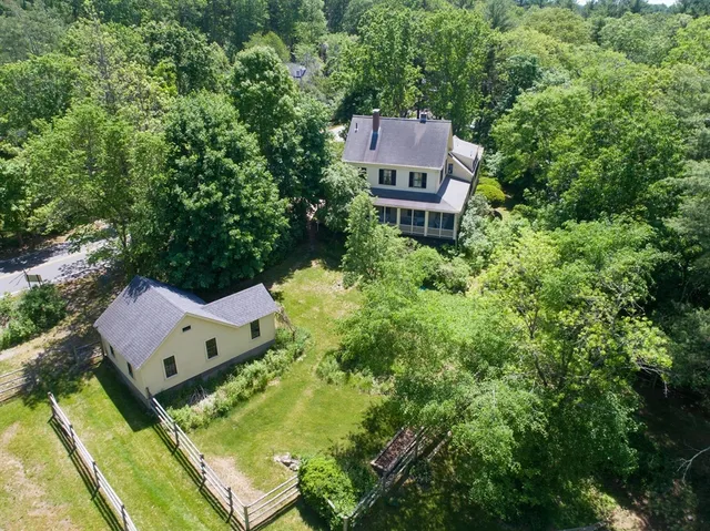an aerial view of a house with swimming pool