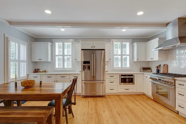 a kitchen with a stove a sink and a refrigerator