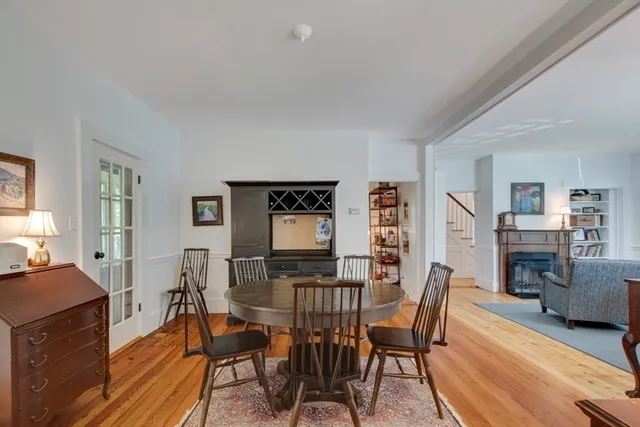 a view of a dining room with furniture and a fireplace
