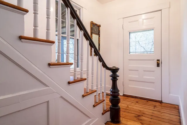a view of entryway with wooden floor
