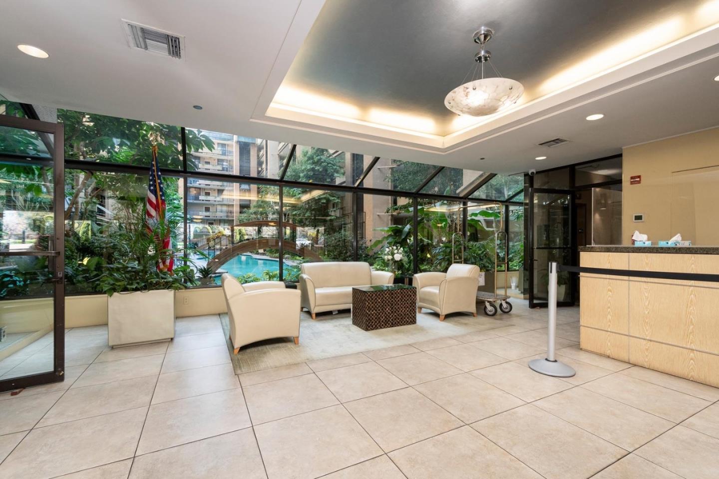 555 Laurel Avenue, Unit 610 San Mateo, CA 94401 - Photo 11 of 14 a living room with patio furniture and a potted plant