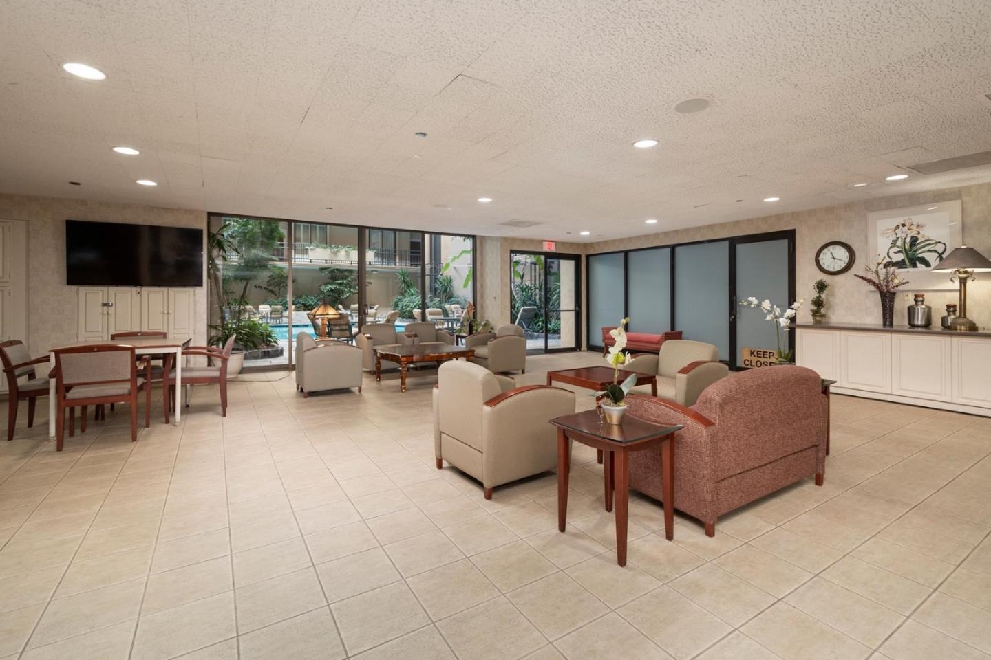 555 Laurel Avenue, Unit 610 San Mateo, CA 94401 - Photo 13 of 14 a living room with furniture and a flat screen tv