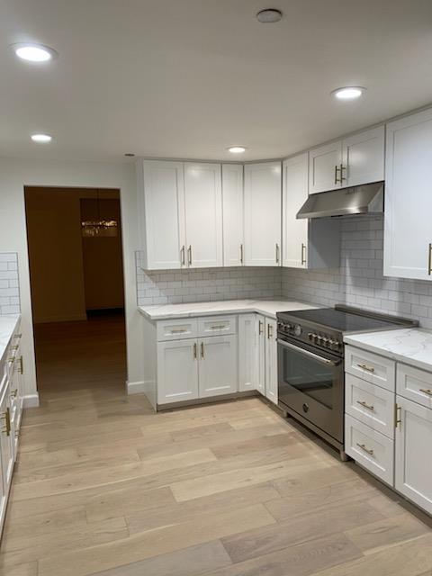 555 Laurel Avenue, Unit 610 San Mateo, CA 94401 - Photo 5 of 14 a kitchen with stainless steel appliances granite countertop a stove and a refrigerator