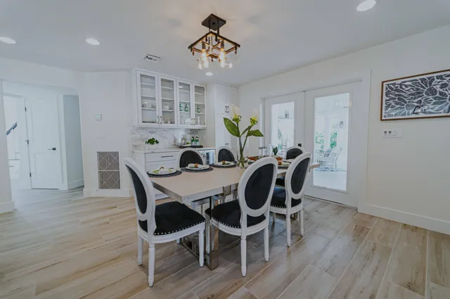 a view of a dining room with furniture window and wooden floor