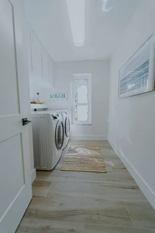 a view of a storage & utility room with dryer and washer