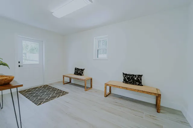 a living room with couch and a table