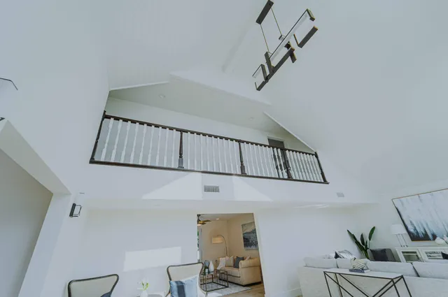 a view of staircase with white walls