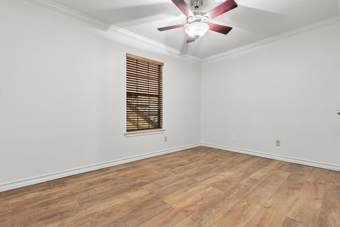 407 East 45th Street, Unit 111 Austin, TX 78751 - Photo 11 of 15 an empty room with a window and a fan