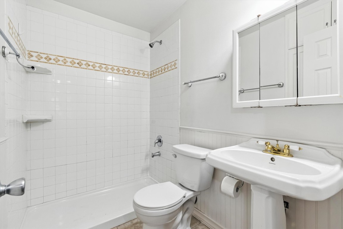407 East 45th Street, Unit 111 Austin, TX 78751 - Photo 14 of 15 a bathroom with a sink a toilet and shower