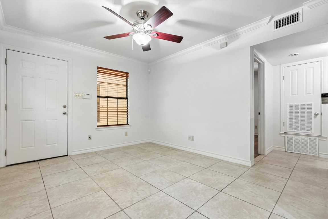 407 East 45th Street, Unit 111 Austin, TX 78751 - Photo 6 of 15 an empty room with windows and fan