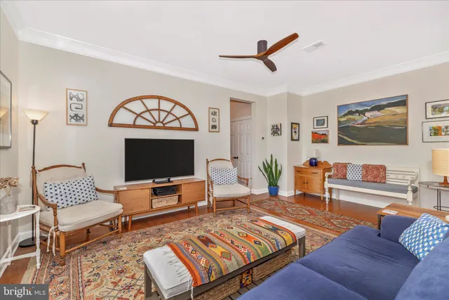 a spacious bedroom with a bed and a table in it