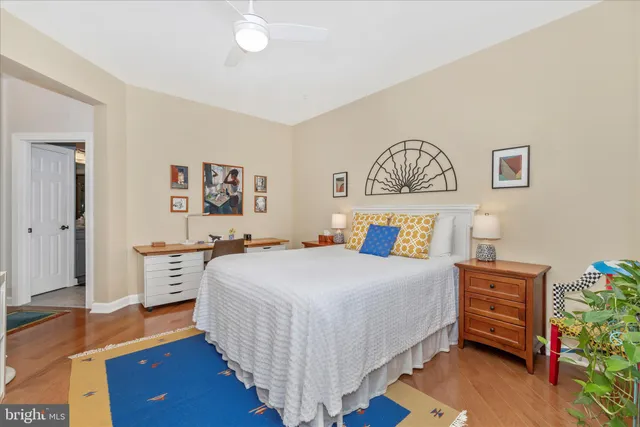 a bedroom with a bed and a dresser