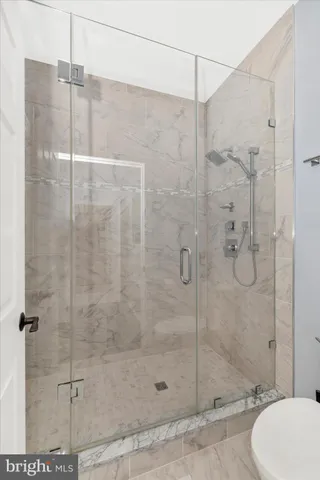 a view of room with furniture and wooden floor