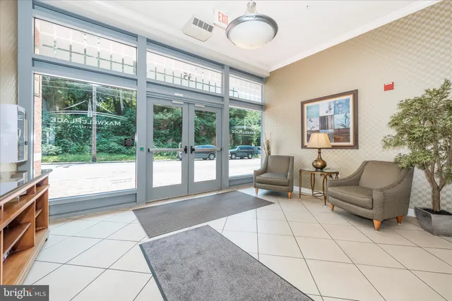 a living room with furniture and a rug