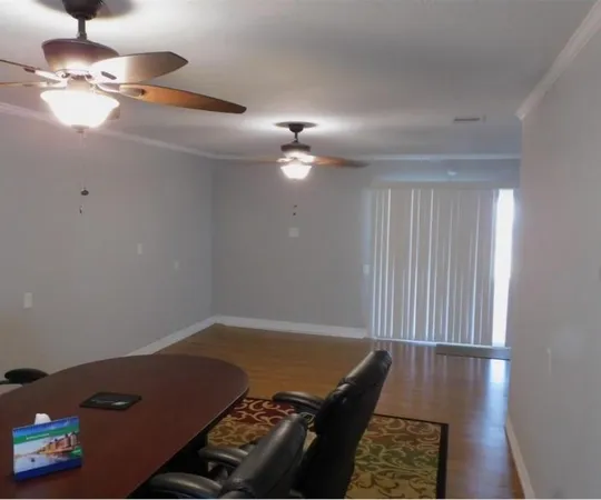 a view of an empty room with a window