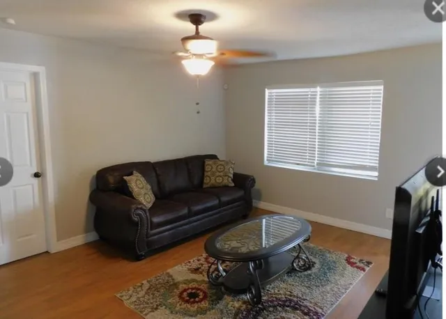 a living room with furniture and a window