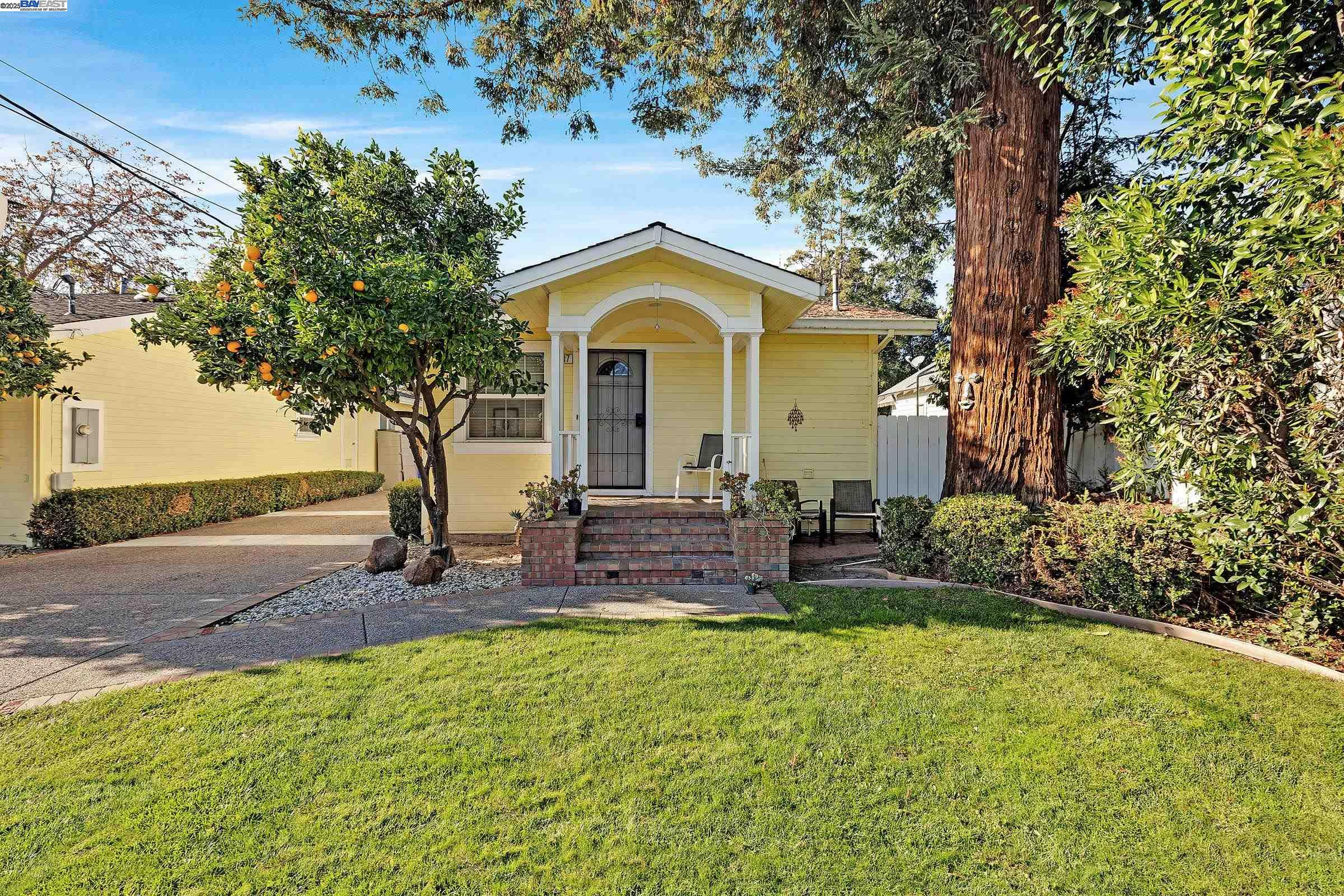 339 I Street Fremont, CA 94536 - Photo 19 of 60 a front view of a house with swimming pool yard and outdoor seating