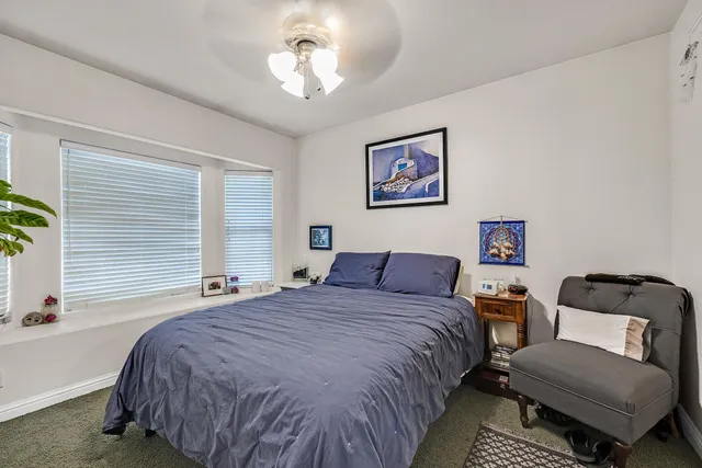 a dining room with furniture and a rug