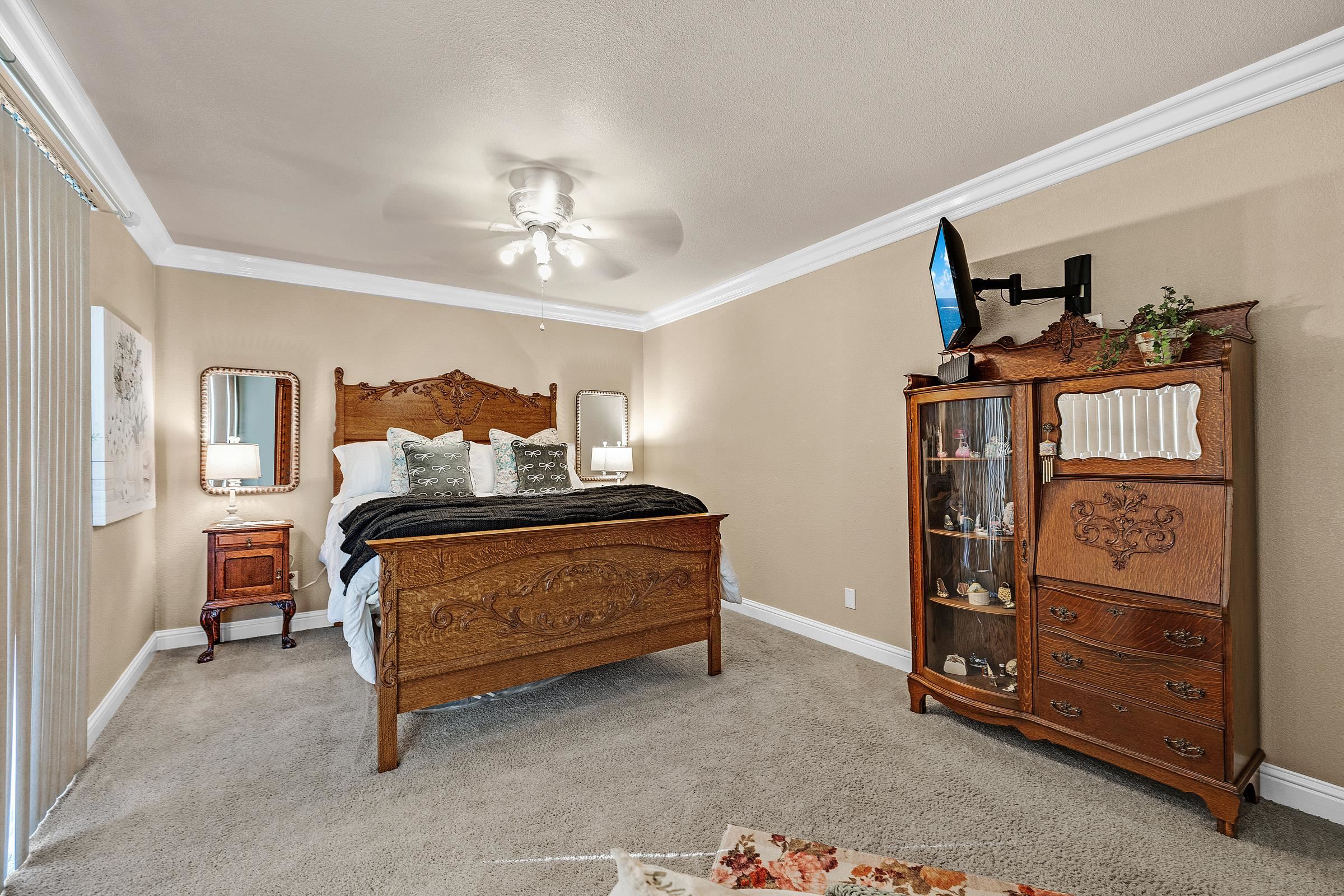 339 I Street Fremont, CA 94536 - Photo 43 of 60 a bedroom with a bed and a chandelier