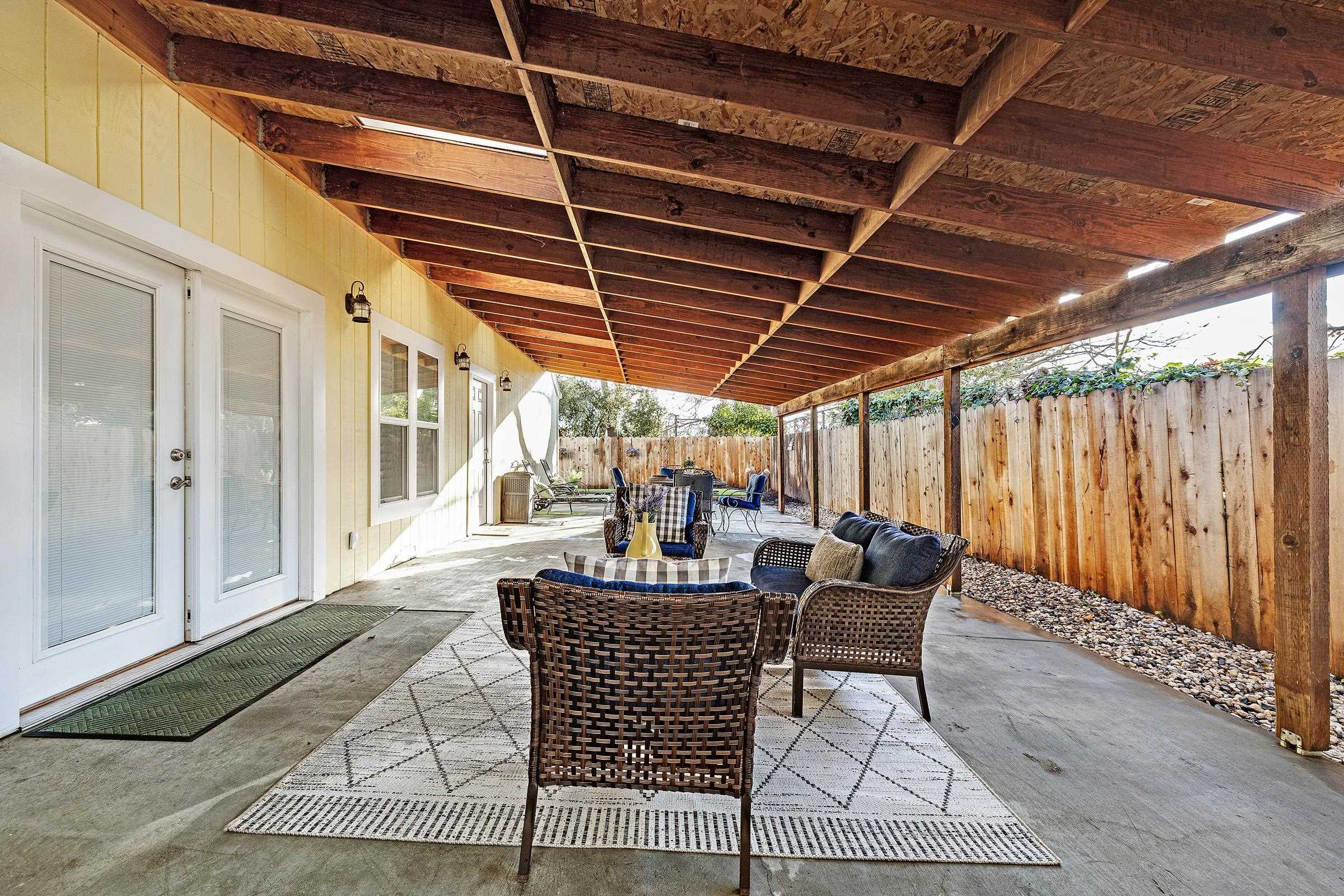 339 I Street Fremont, CA 94536 - Photo 49 of 60 a dining room with furniture and a rug