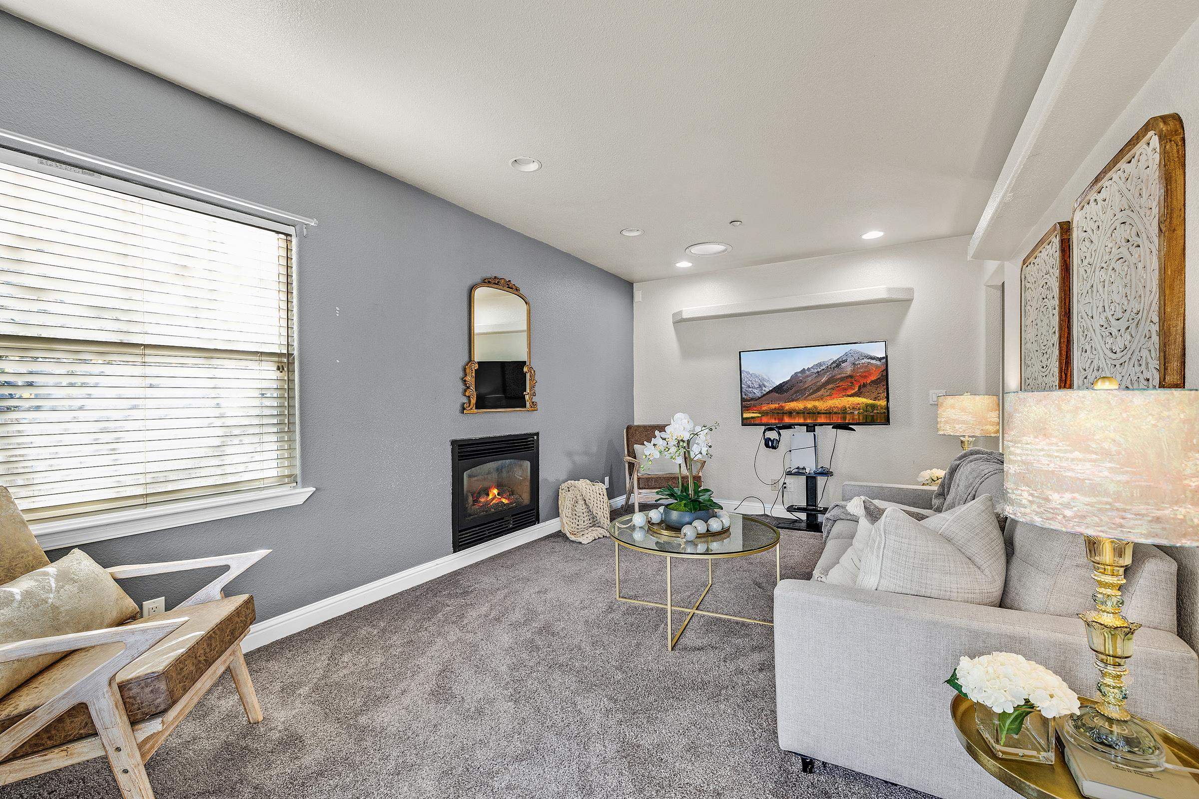 339 I Street Fremont, CA 94536 - Photo 6 of 60 a living room with furniture a fireplace and a flat screen tv