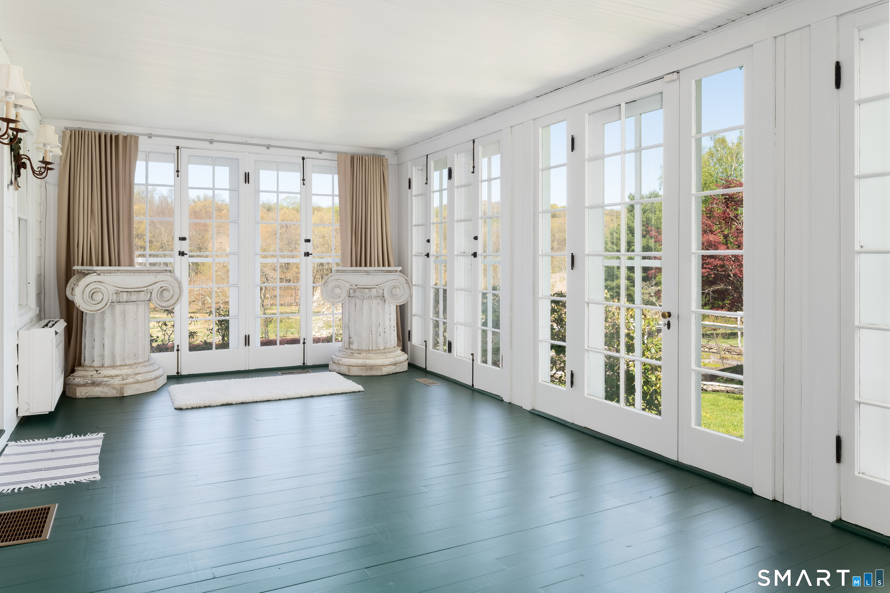 155 Long Ridge Road Danbury, CT 06810 - Photo 25 of 40 The sun room offers one of the lighter and more intimate moments of the house, surrounded by windows and garden outlooks.