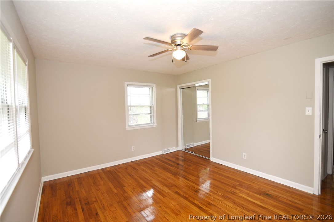 1673 Norment Road Lumberton, NC 28360 - Photo 17 of 32 a view of an empty room with chandelier fan and a window