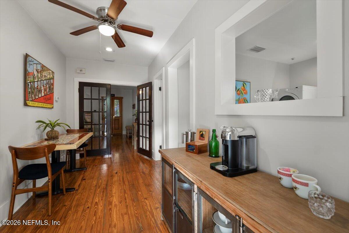 71 Kings Ferry Way St. Augustine, FL 32084 - Photo 15 of 33 a kitchen with stainless steel appliances a dining table chairs and wooden floor