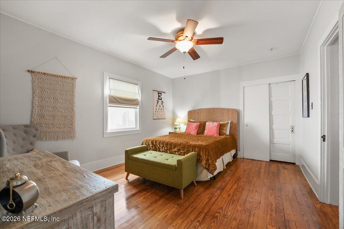 71 Kings Ferry Way St. Augustine, FL 32084 - Photo 19 of 33 a bedroom with a bed and wooden floor