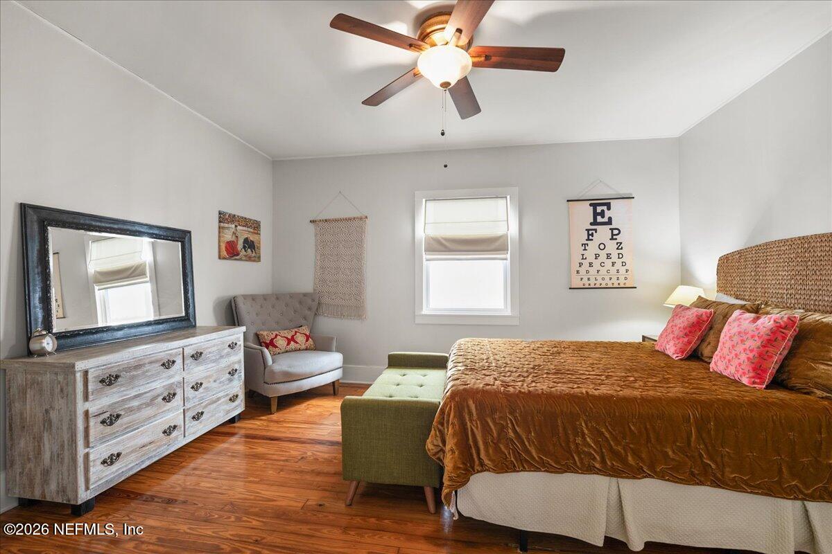 71 Kings Ferry Way St. Augustine, FL 32084 - Photo 21 of 33 a bedroom with a bed and wooden floor