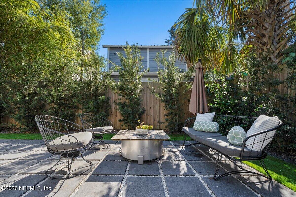 71 Kings Ferry Way St. Augustine, FL 32084 - Photo 25 of 33 a view of a patio with couches table and chairs and potted plants