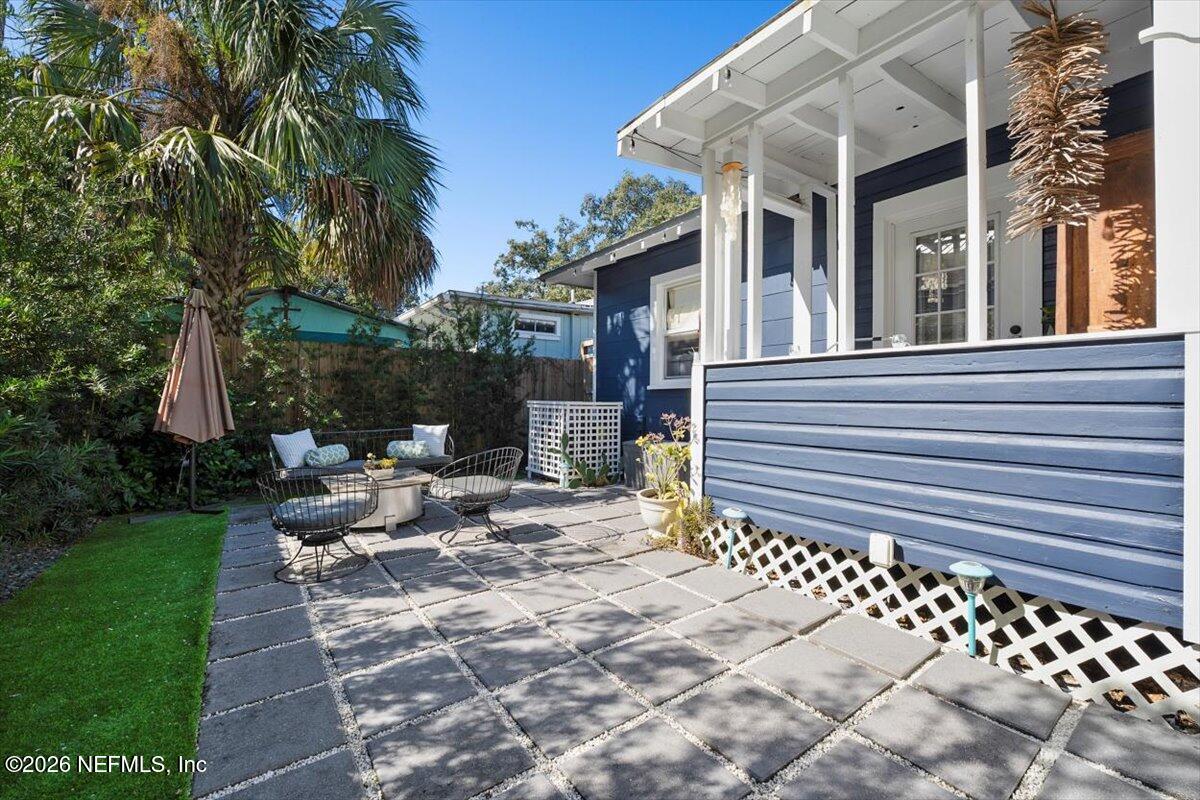 71 Kings Ferry Way St. Augustine, FL 32084 - Photo 26 of 33 a view of a patio with table and chairs and potted plants