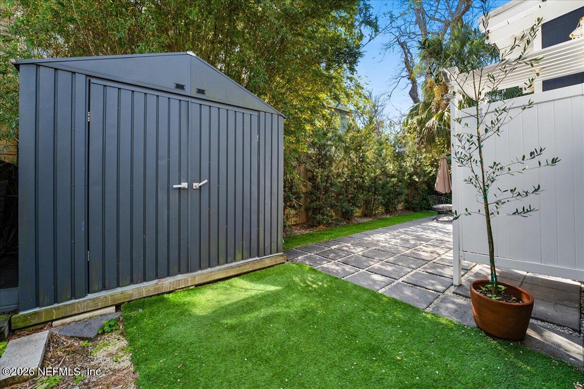 71 Kings Ferry Way St. Augustine, FL 32084 - Photo 32 of 33 a view of a backyard with potted plants