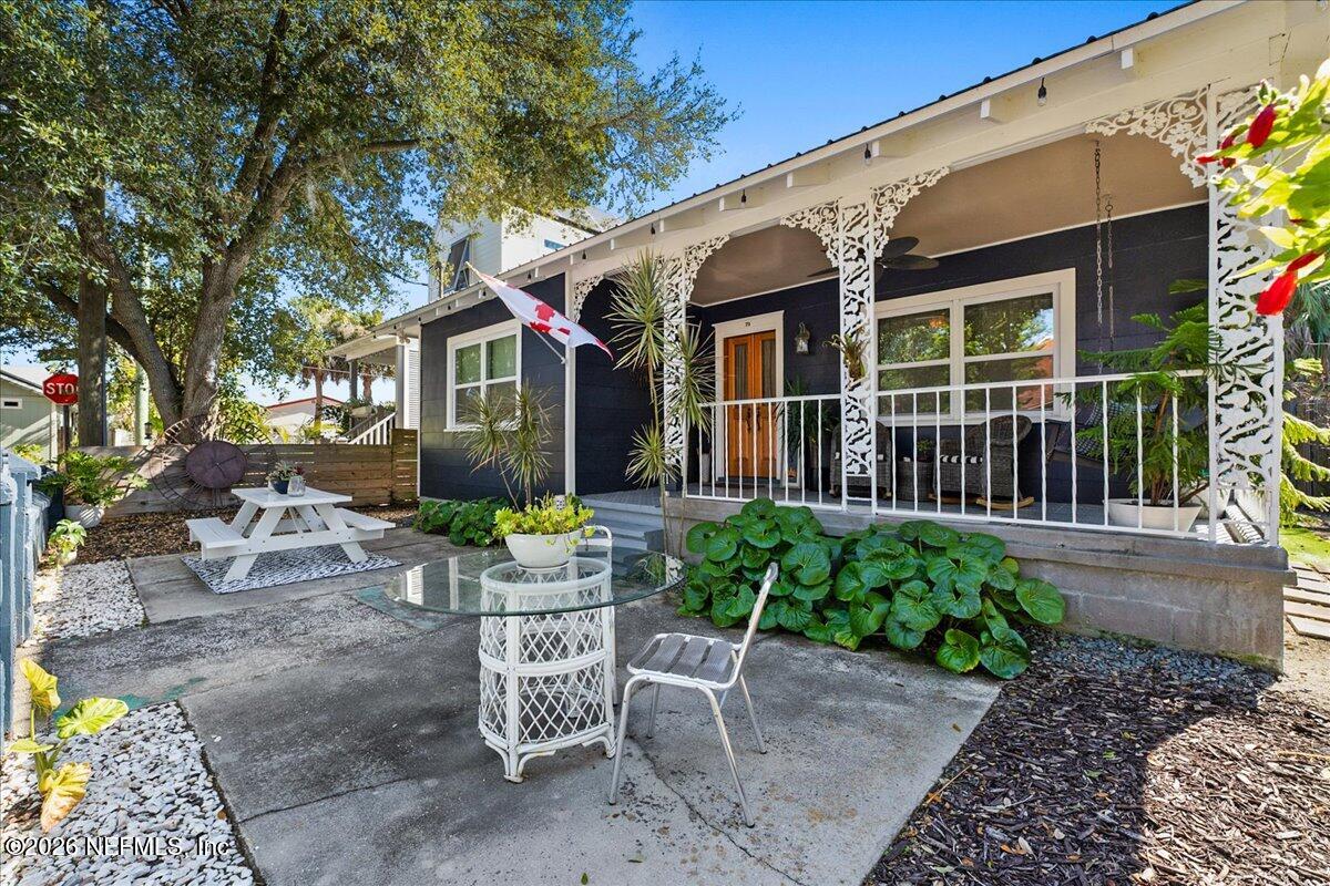 71 Kings Ferry Way St. Augustine, FL 32084 - Photo 5 of 33 a view of a house with backyard sitting area and garden
