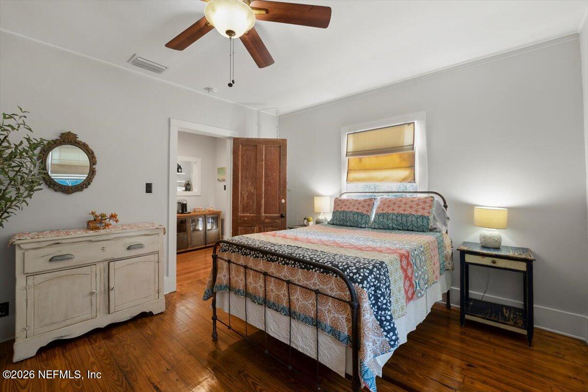 71 Kings Ferry Way St. Augustine, FL 32084 - Photo 8 of 33 a bed room with a bed and a chandelier