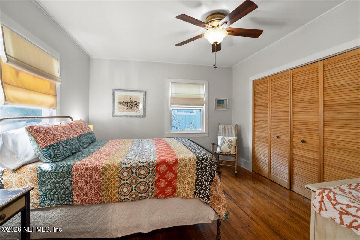 71 Kings Ferry Way St. Augustine, FL 32084 - Photo 9 of 33 a bedroom with two beds and a chandelier