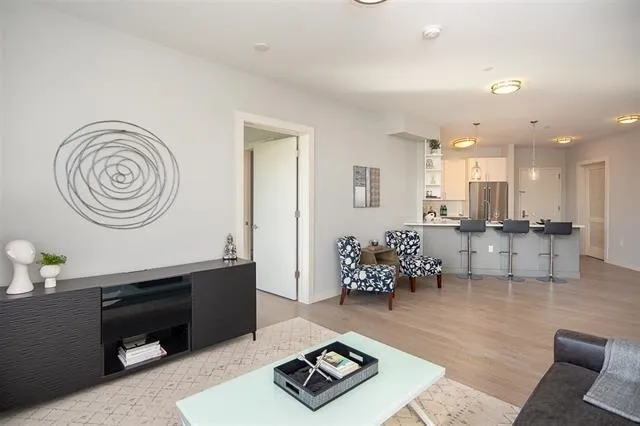 a living room with furniture and a table