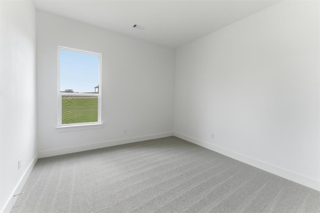 906 Perrin Lane Van Alstyne, TX 75495 - Photo 17 of 30 an empty room with a window